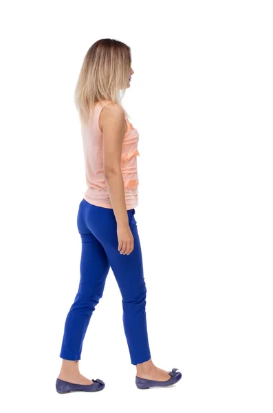 Back view of walking  woman. beautiful blonde girl in motion.  b — Stockfoto