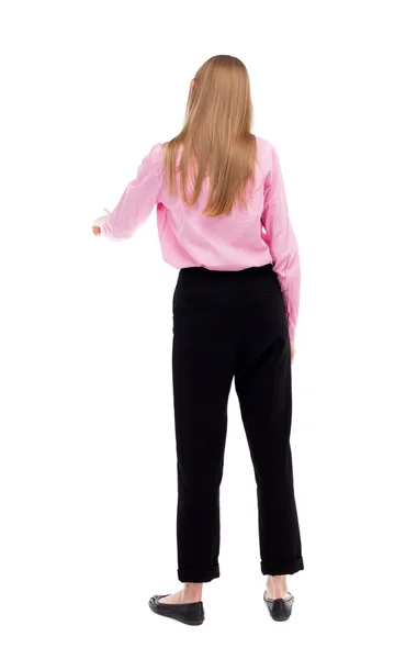 Back view of young business woman presses down on something. — Foto de Stock