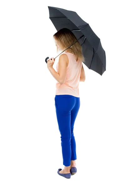 Jovem mulher sob um guarda-chuva — Fotografia de Stock