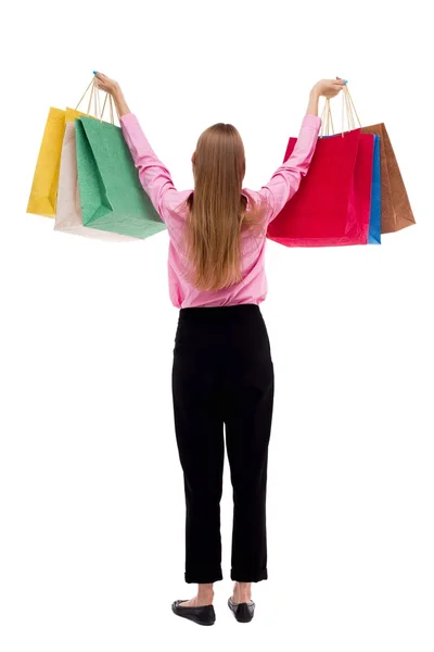 Vista posteriore della donna con borse della spesa  . — Foto Stock