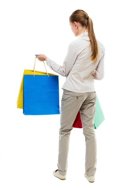 Achteraanzicht van vrouw met shopping tassen . — Stockfoto