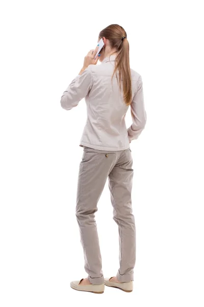 Back view of woman talking on phone. — Foto de Stock