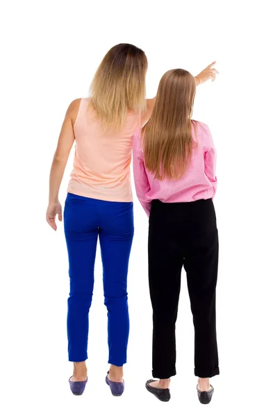 Widok dwóch wskazując młoda dziewczyna z tyłu. — Zdjęcie stockowe
