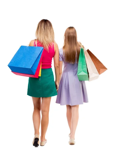 Back view of  two women  with shopping bags — ストック写真