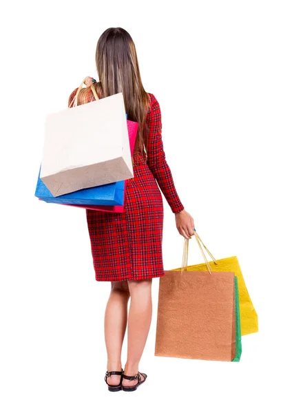 Achteraanzicht van vrouw met shopping tassen . — Stockfoto