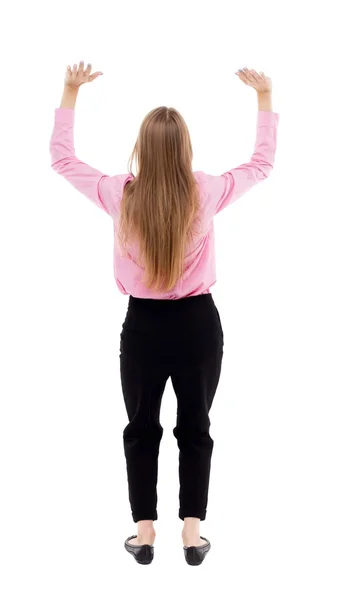 Back view of business woman  protects hands from what is falling — Stock fotografie