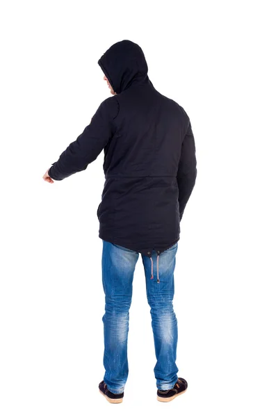 Back view of  pointing young men in parka. — Stock Photo, Image