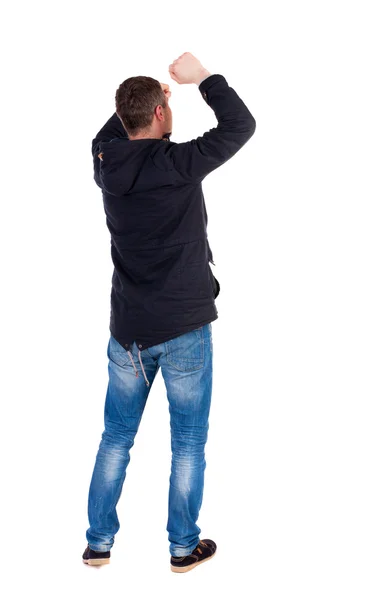 Back view of  man.  Raised his fist up in victory sign. — Stock Photo, Image