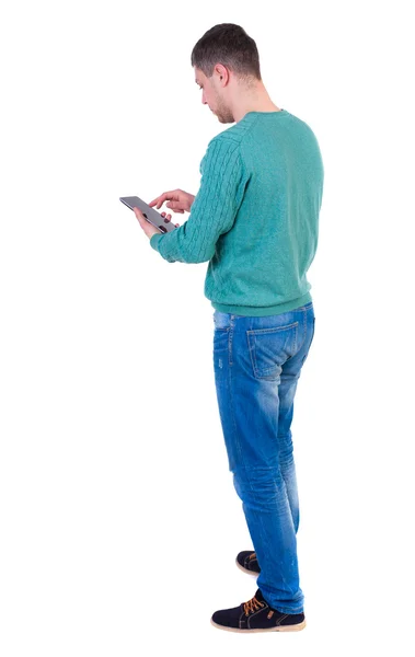 Back view of business man uses mobile phone. – stockfoto