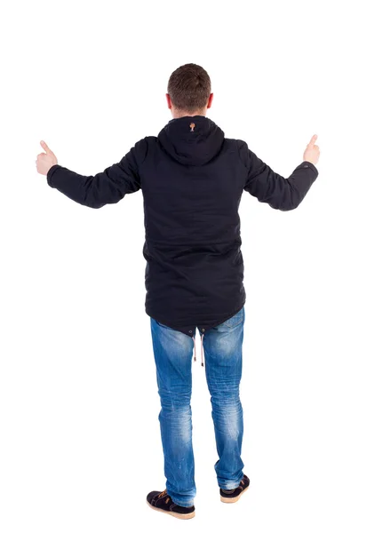 Back view of  man in jacket shows thumbs up. — Stock Photo, Image
