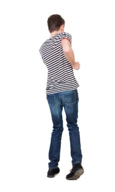 man in a jacket raised his hands in prayer.