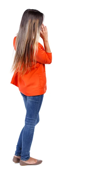 Back view of standing young beautiful  woman using a mobile phon — Stock Photo, Image