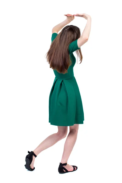 Vista traseira da mulher protege as mãos de que está caindo. — Fotografia de Stock