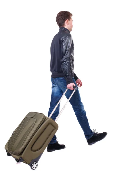 Back view of walking  man  with suitcase. — Stock Photo, Image