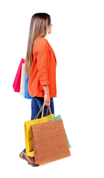 Side view of going  woman  with shopping bags . — Fotografia de Stock