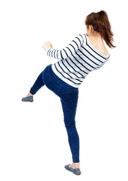 Bakifrån av kvinna roliga matcher vifta med armarna och benen. — Stockfoto