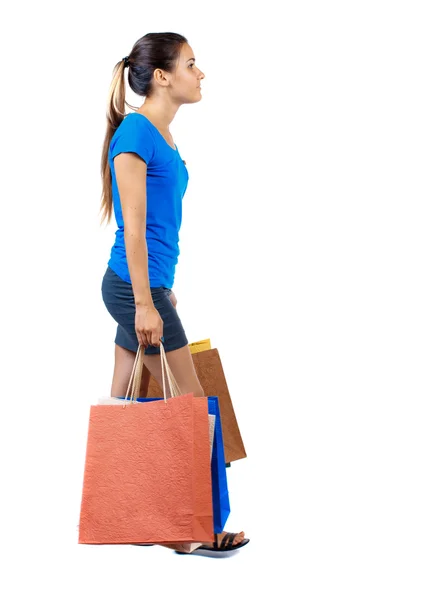 Side view of going  woman  with shopping bags . — Stock Fotó