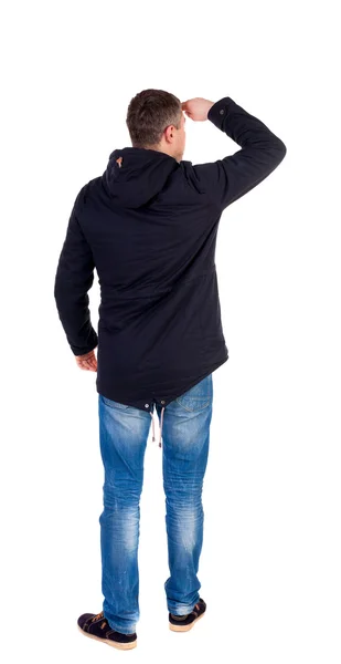 Back view of handsome man in winter jacket  looking up. — Stock Photo, Image