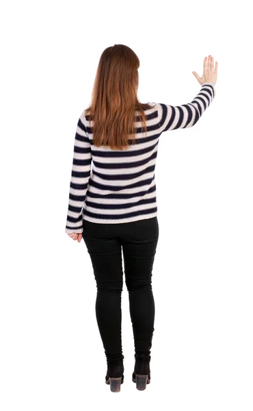Back view of young woman presses down on something — Stock Photo, Image