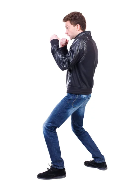 Back view of guy funny fights waving his arms and legs. — Stock Photo, Image