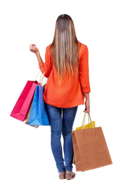 Vista trasera de la mujer con bolsas de compras — Foto de Stock