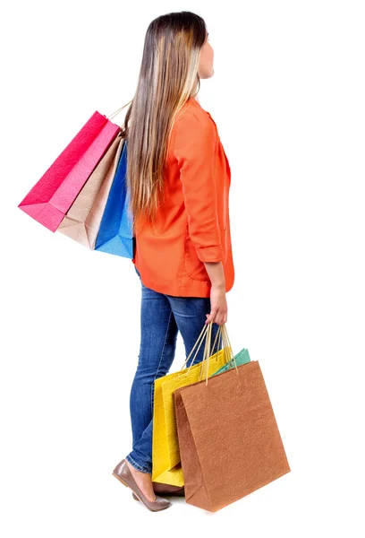 Arkadan görünümü olan kadın alışveriş torbaları — Stok fotoğraf