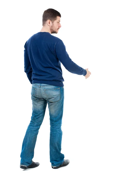 Back view of businessman reaches out to shake hands. — Stock Photo, Image