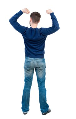 arkadan görünüşü adam. zafer işareti yumruğunu kaldırdı.