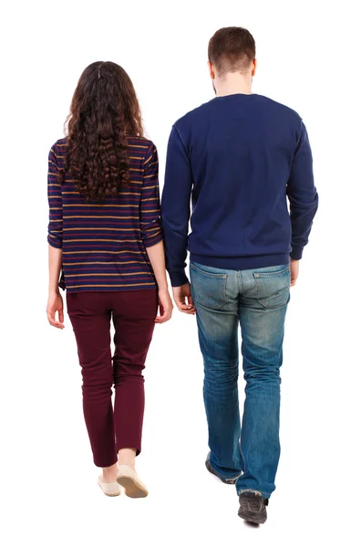 Back view going couple. walking friendly girl and guy holding h — Stock Photo, Image