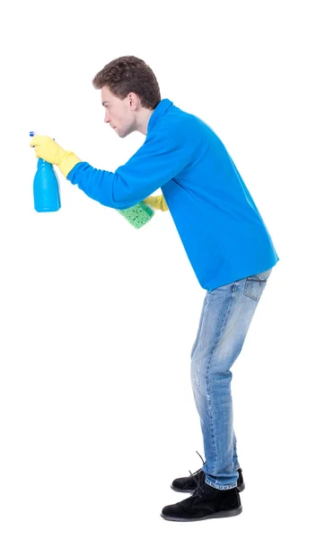 Side view of a cleaner man in gloves with sponge and detergent. — Stock Photo, Image