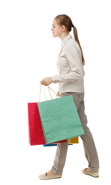 Side view of going  woman  with shopping bags . — Stok fotoğraf