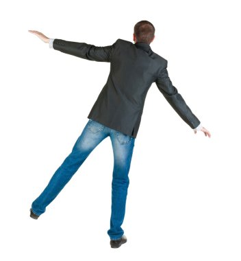 işadamı Dengeleme. arka görünüm.