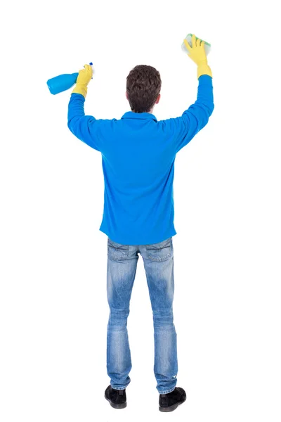 Back view of a cleaner man in gloves with sponge and detergent. — Stock Photo, Image