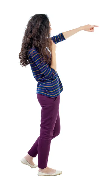 Back view of  pointing woman. beautiful girl. — Stock Photo, Image