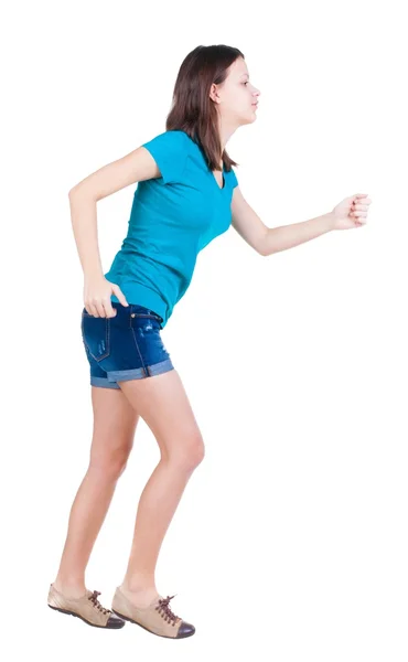 Back view of running  woman. beautiful brunette girl in motion. — Stockfoto