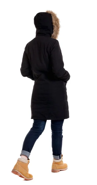 Back view of going  woman in parka. — Stock Photo, Image