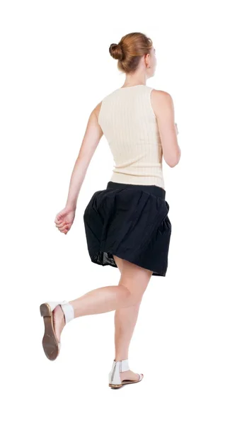 Back view of running  woman in dress — Stock Photo, Image