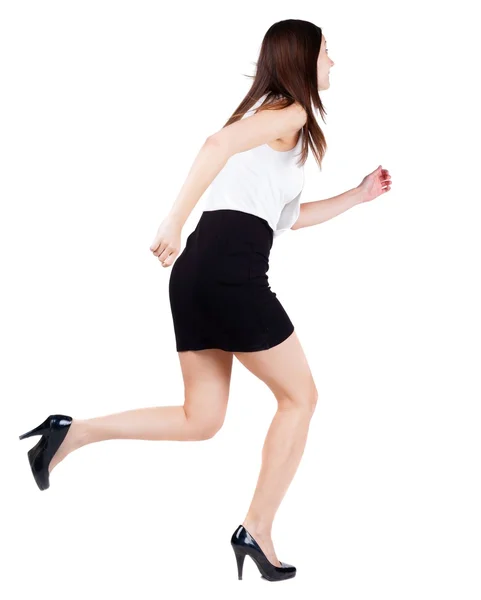 Οπίσθια όψη της τρέχοντας γυναίκα σε φόρεμα. — Φωτογραφία Αρχείου