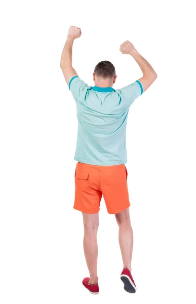 Back view of  joyful man celebrating victory hands up. — Foto de Stock