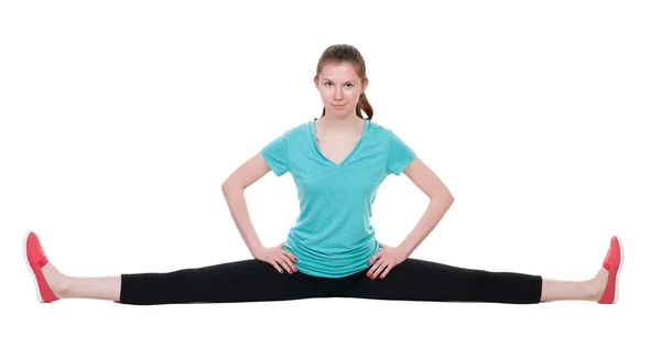 Front view of the girl in sportswear sitting on the longitudinal — Stock Photo, Image