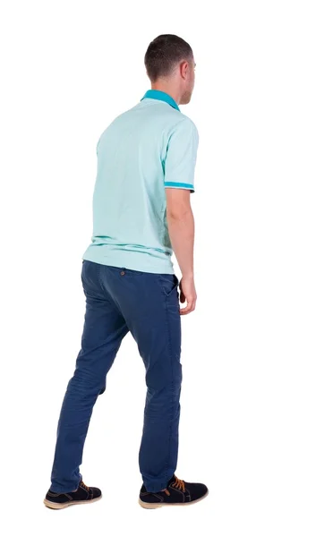 Rückansicht eines gutaussehenden Mannes in Jeans und Hemd. — Stockfoto