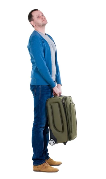 Back view of man with  green suitcase looking up. — Stock Photo, Image