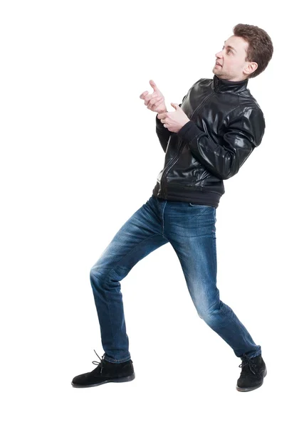 Back view of standing man pulling a rope from the top or cling t — Stock Photo, Image