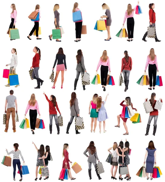 Collection " back view of going people with shopping bags " — Stockfoto