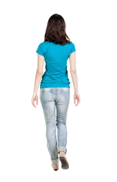 Back view of walking  woman in jeans . — Stock Photo, Image