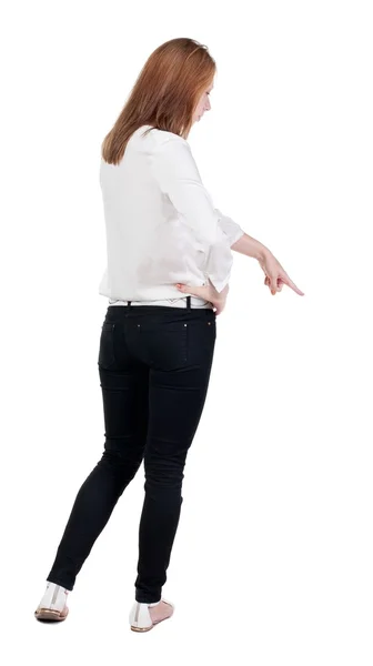 Back view of  pointing woman. — Stock Photo, Image