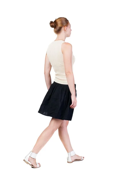 Back view of walking  woman in dress. beautiful blonde girl in m — Stock Photo, Image