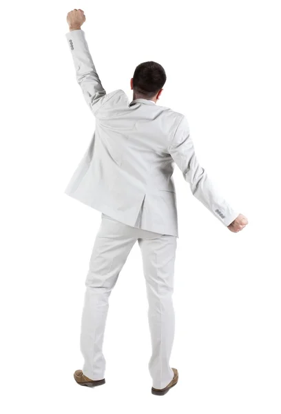 Businessman thumbs up. rear view. Royalty Free Stock Images