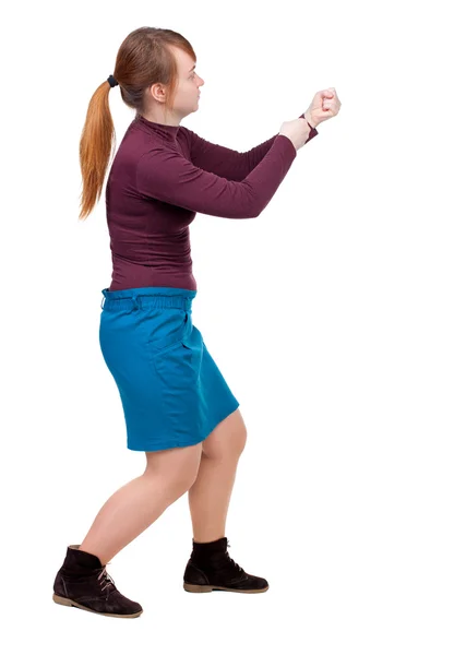Pohled zezadu na stojící dívka tahání lana od horního nebo držet — Stock fotografie