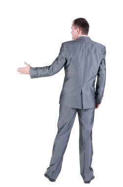 el sallamak için uzanan bir iş adamı. arka görünüm.